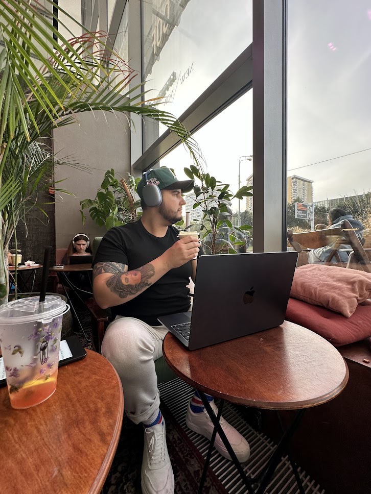 Gabriel working from a coffee shop